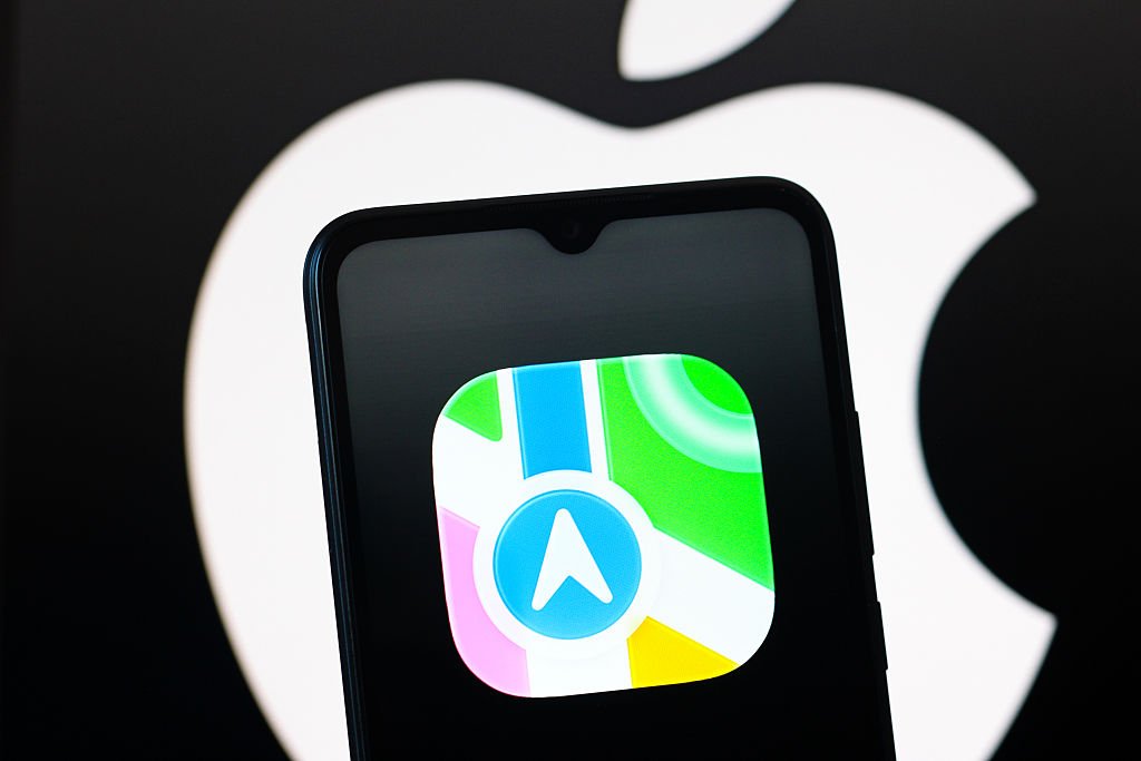 In this photo illustration, the Apple Maps logo is seen